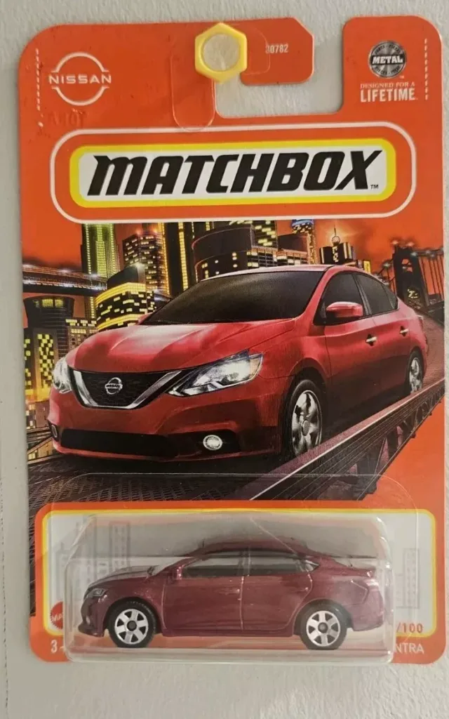 Matchbox 2016 Nissan Sentra, rojo metalizado, 2024, MBX Metro 9/100 HVL30